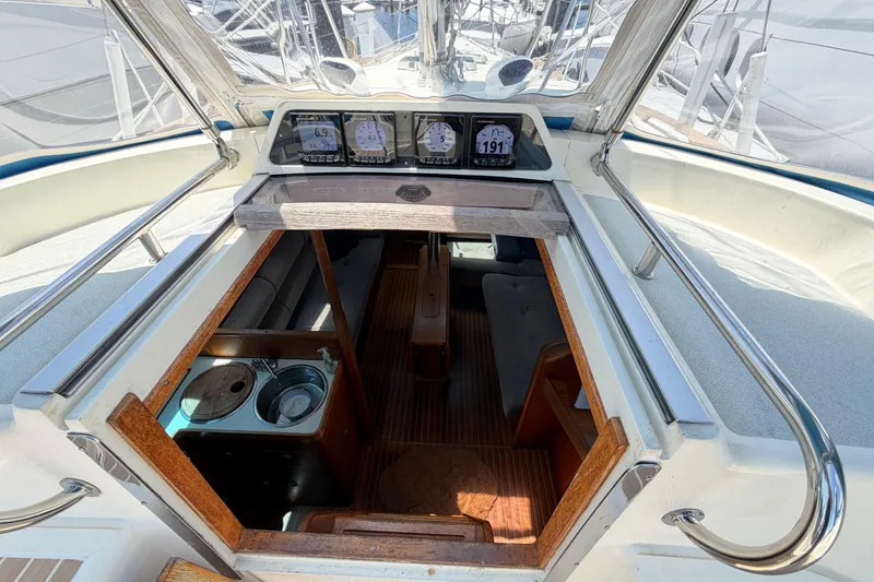 Slide: The Image of Interior view of a 1987 Moody 376 sailboat, showcasing the cabin entrance and navigation instruments. - 21