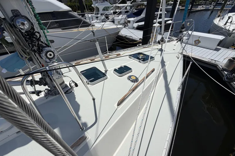 Slide: The Image of Sailboat deck view of 1987 Moody 376, docked in a marina. - 6