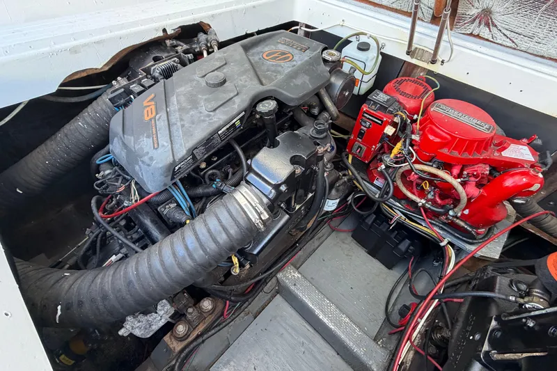 Slide: The Image of Engine compartment of a 1973 Chris-Craft 30 Tournament FB, featuring a V8 engine. - 30