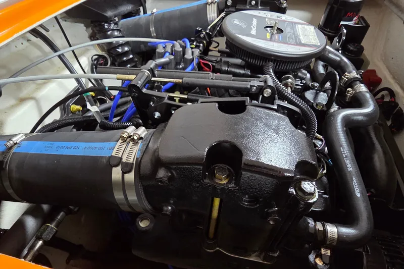 Slide: The Image of Engine compartment of a 2012 Hornet Marine 17 boat, showcasing detailed components. - 22