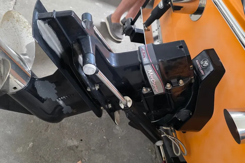 Slide: The Image of Close-up of a 2012 Hornet Marine 17 boat's MerCruiser engine and propeller. - 7
