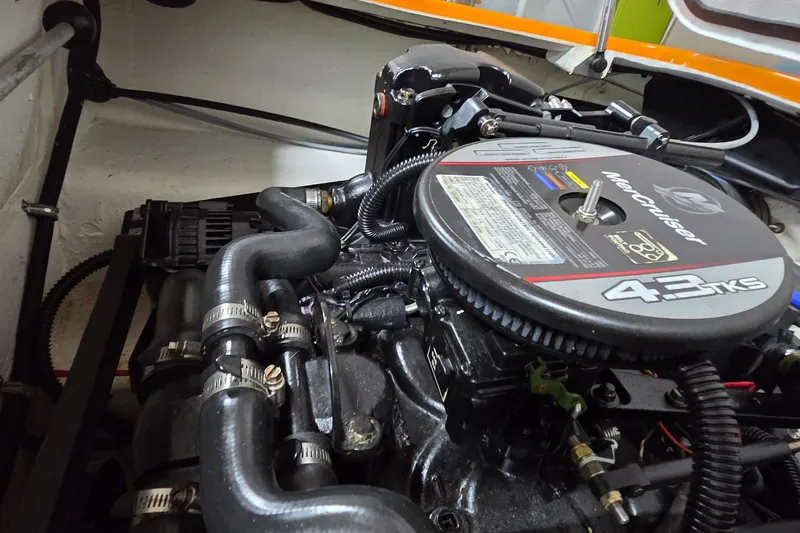 Slide: The Image of Engine compartment of a 2012 Hornet Marine 17 boat with MerCruiser 4.3 TKS engine. - 19