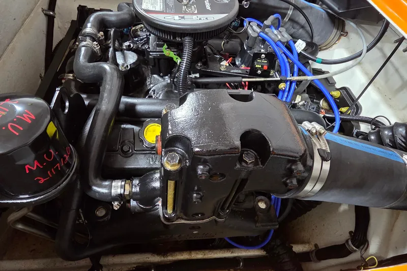 Slide: The Image of Engine compartment of a 2012 Hornet Marine 17 boat, showcasing detailed components and wiring. - 20