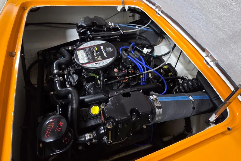 Slide: The Image of Engine compartment of a 2012 Hornet Marine 17 boat, showcasing detailed components. - 17