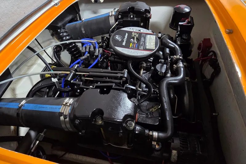 Slide: The Image of Engine compartment of a 2012 Hornet Marine 17 boat, featuring a MerCruiser engine. - 21