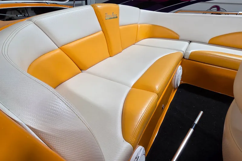 Slide: The Image of Orange and white seating in a 2012 Hornet Marine 17 boat interior. - 24