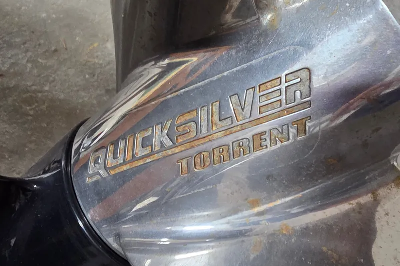Slide: The Image of Quicksilver Torrent propeller on a 2012 Hornet Marine 17 boat, showing metallic finish. - 33