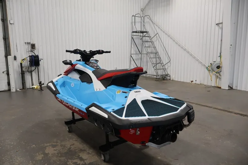 Slide: The Image of 2027 Yamaha WaveRunner JetBlaster DLX 3-Up in a garage setting. - 17