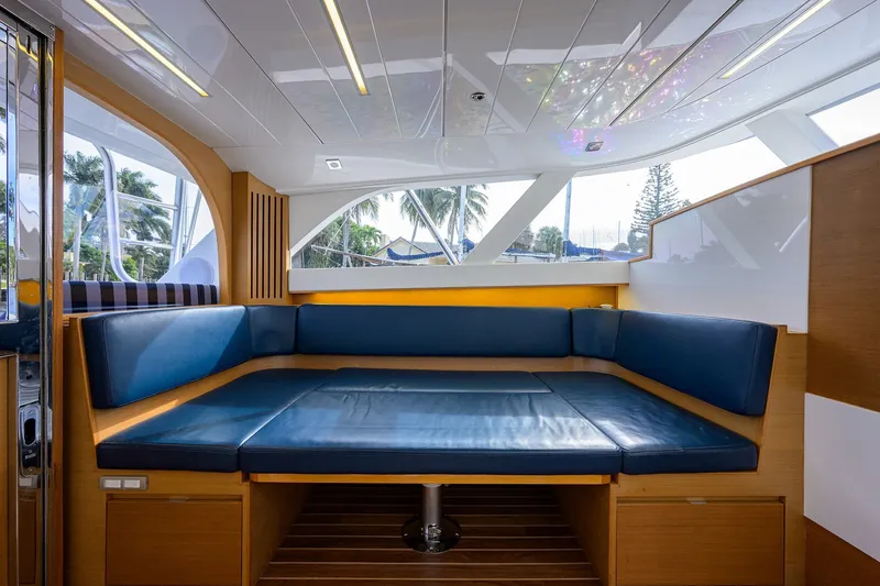 Slide: The Image of Luxurious interior of 2018 Bertram 35 Flybridge yacht with blue seating and wood accents. - 38