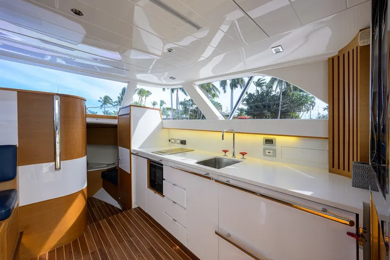 Slide: The Image of Luxurious interior of 2018 Bertram 35 Flybridge yacht with modern kitchen design. - 32
