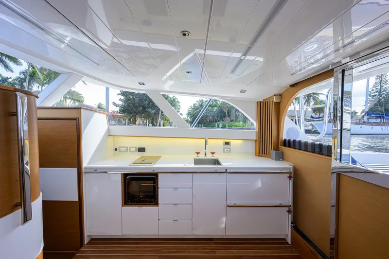 Slide: The Image of Luxurious interior of 2018 Bertram 35 Flybridge yacht with modern kitchen design. - 33