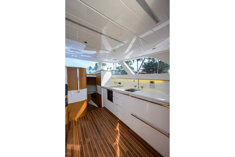 Slide: The Image of Luxurious interior of 2018 Bertram 35 Flybridge yacht with modern kitchen design. - 31