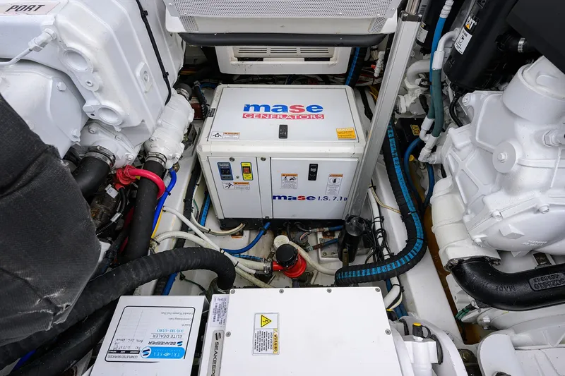 Slide: The Image of Engine room of 2018 Bertram 35 Flybridge with Mase generator and mechanical components. - 52