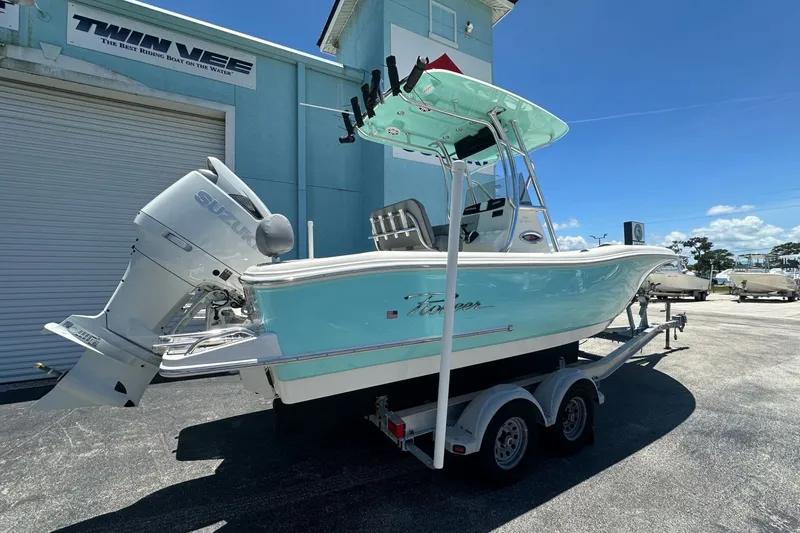 Slide: The Image of 2027 Pioneer 222 Sportfish boat on trailer, featuring Suzuki outboard motor. - 4