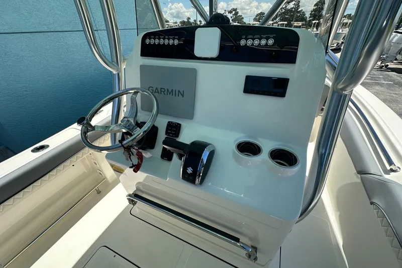 Slide: The Image of 2027 Pioneer 222 Sportfish boat console with Garmin navigation and steering wheel. - 6