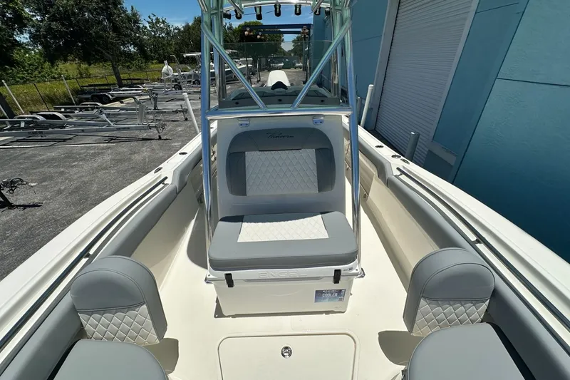 Slide: The Image of 2027 Pioneer 222 Sportfish boat interior with cushioned seating and sleek design. - 8