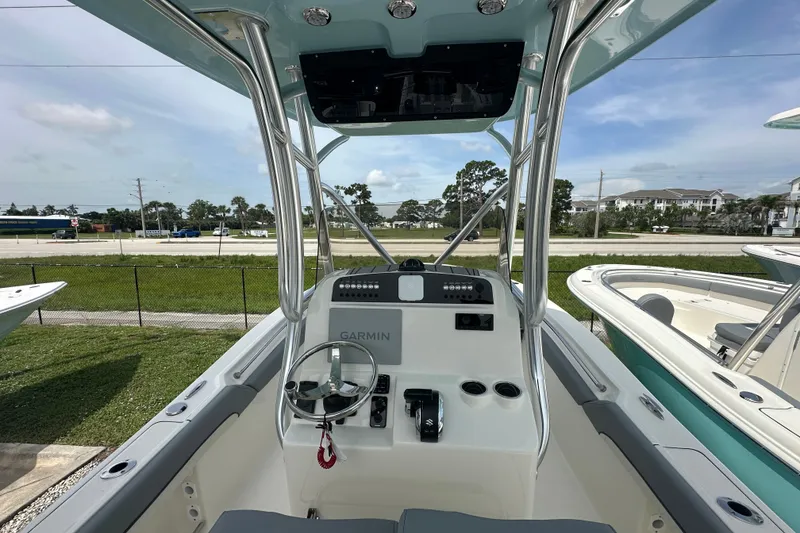 Slide: The Image of 2027 Pioneer 222 Sportfish boat cockpit with Garmin navigation system and steering wheel. - 4
