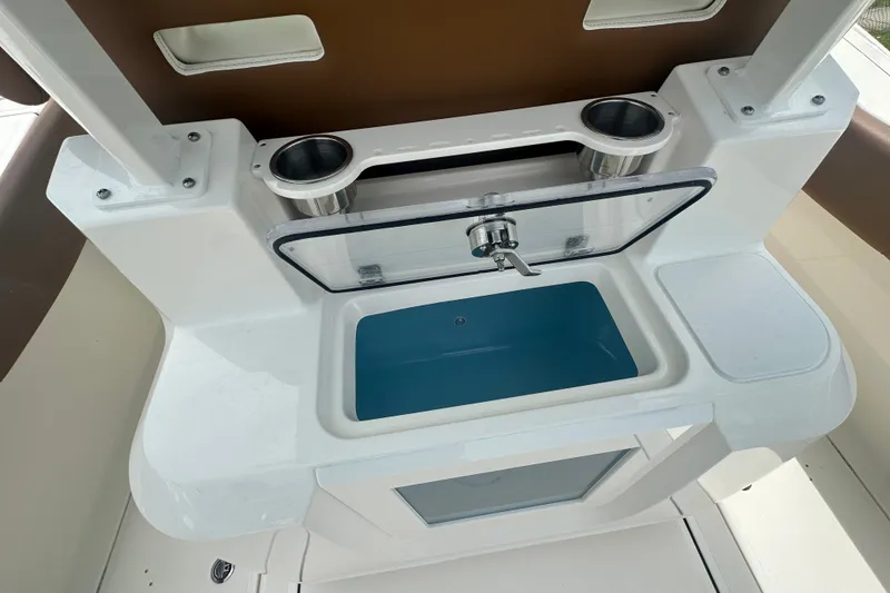 Slide: The Image of Interior view of 2027 Pioneer 270 Pelagic boat featuring a sink and cup holders. - 11
