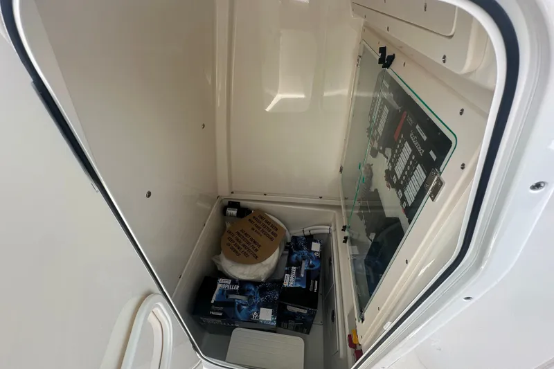 Slide: The Image of Interior storage compartment of 2027 Pioneer 270 Pelagic boat with equipment and supplies. - 8
