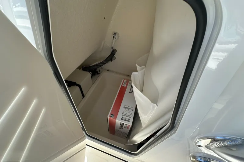 Slide: The Image of Storage compartment in 2027 Pioneer 202 Islander boat with equipment box inside. - 8