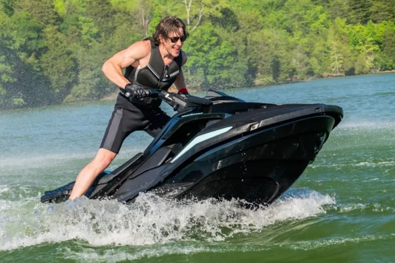 Slide: The Image of Man riding 2027 Yamaha WaveRunner JetBlaster PRO 2-Up on a lake. - 2