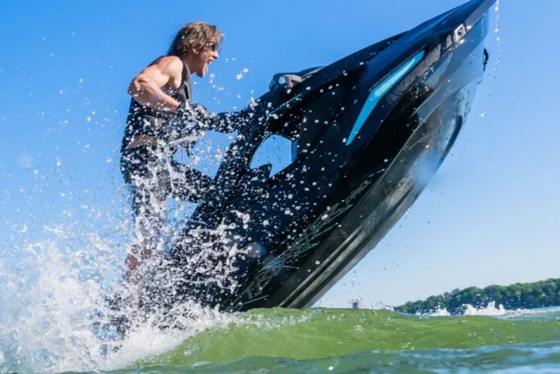 Slide: The Image of 2027 Yamaha WaveRunner JetBlaster PRO 2-Up performing a dynamic water stunt. - 4