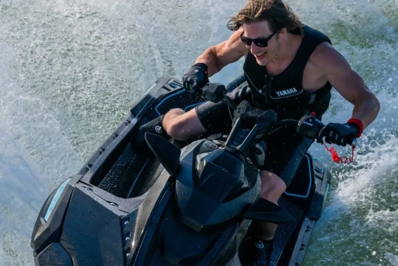 Slide: The Image of Man riding 2027 Yamaha WaveRunner JetBlaster PRO 2-Up on water, wearing sunglasses and life vest. - 7