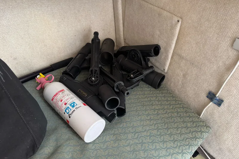 Slide: The Image of Fire extinguisher and equipment inside a 2003 Trophy 1802 Walkaround boat cabin. - 28