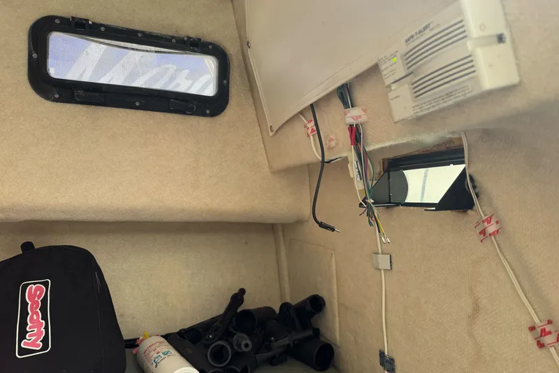 Slide: The Image of Interior of a 2003 Trophy 1802 Walkaround boat with wiring and equipment. - 26