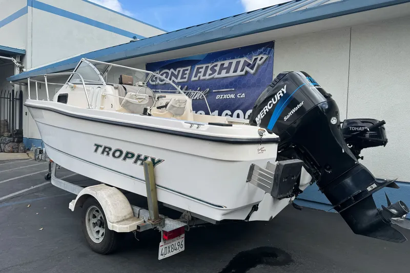 Slide: The Image of 2003 Trophy 1802 Walkaround boat with Mercury outboard motor on trailer. - 8
