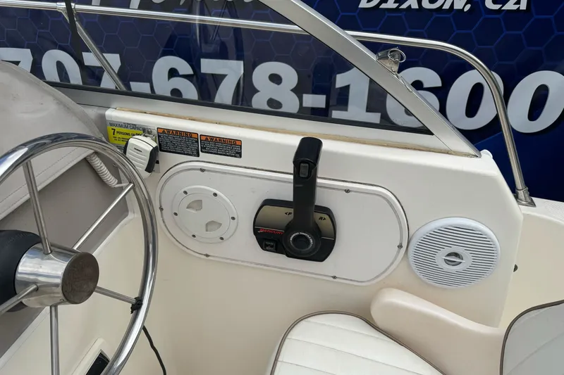 Slide: The Image of 2003 Trophy 1802 Walkaround boat steering wheel and control panel close-up. - 30