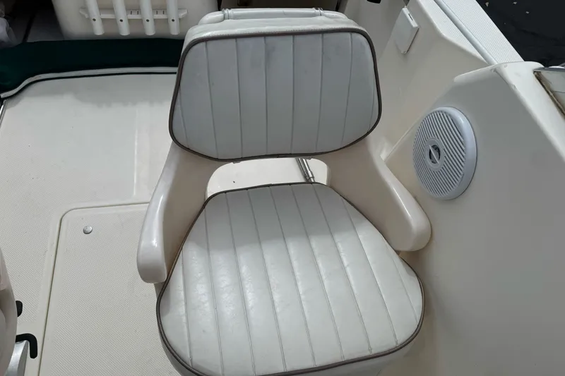 Slide: The Image of 2003 Trophy 1802 Walkaround boat seat with white upholstery and speaker. - 13