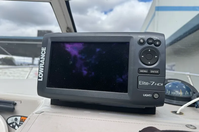 Slide: The Image of Lowrance Elite-7 HDI fishfinder on 2003 Trophy 1802 Walkaround boat dashboard. - 23