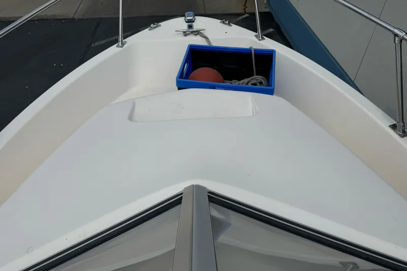 Slide: The Image of Bow of 2003 Trophy 1802 Walkaround boat with storage compartment and railing. - 10