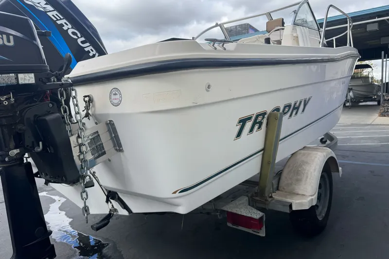 Slide: The Image of 2003 Trophy 1802 Walkaround boat on trailer with Mercury outboard motor. - 5