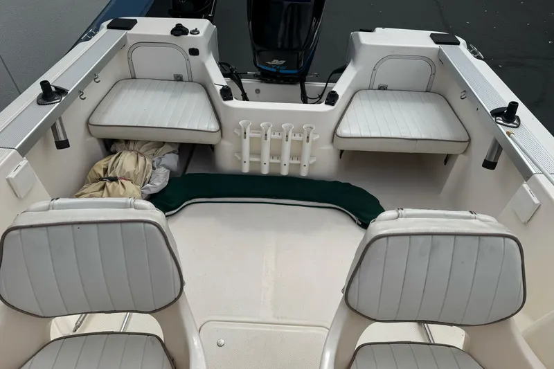 Slide: The Image of 2003 Trophy 1802 Walkaround boat interior with seating and storage compartments. - 11
