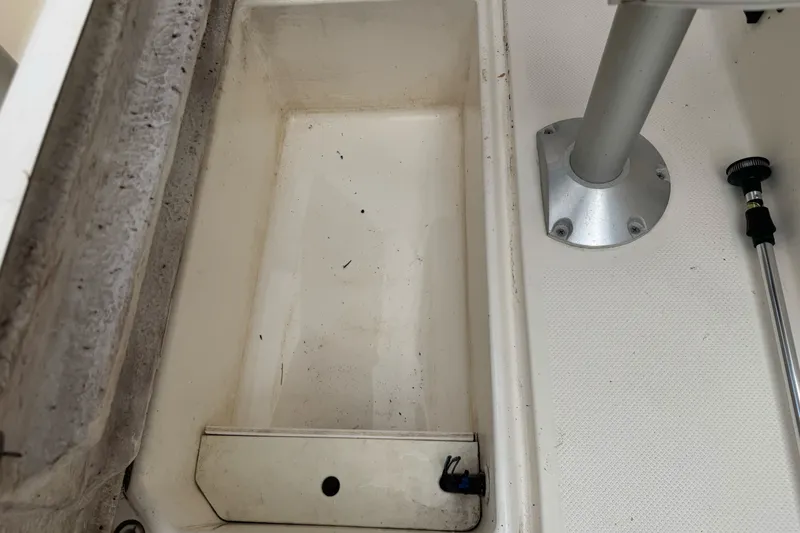Slide: The Image of Storage compartment of a 2003 Trophy 1802 Walkaround boat, showing interior details. - 32