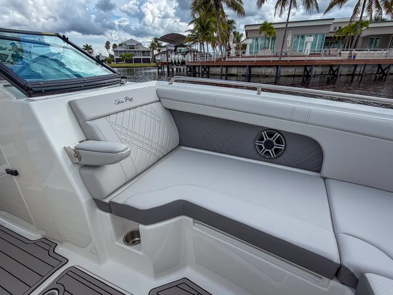 Slide: The Image of The 2027 Sea Ray SDX 290 Outboard features a luxurious seating area with stylish upholstery. - 18
