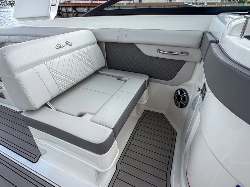 Slide: The Image of The 2027 Sea Ray SDX 290 Outboard features an elegant seating area with gray upholstery. - 14