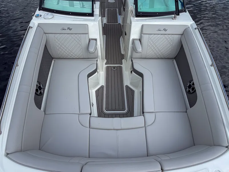 Slide: The Image of The image shows the spacious cockpit of a Sea Ray SDX 290 Outboard with elegant upholstery. - 20