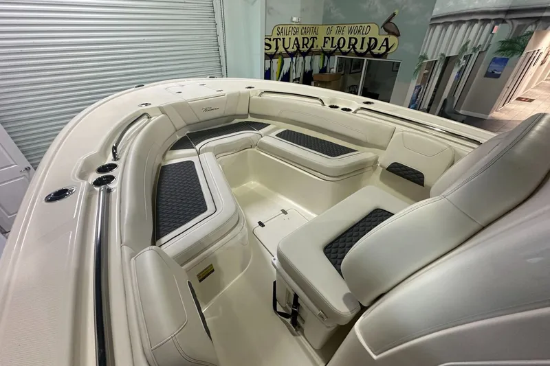 Slide: The Image of Interior view of 2026 Pioneer 250 Pelagic boat with cushioned seating. - 6