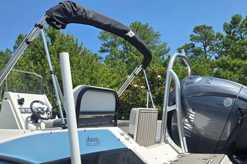 Slide: The Image of 2025 Starcraft SVX 191 OB CC boat with Yamaha engine, featuring sleek design and modern controls. - 8