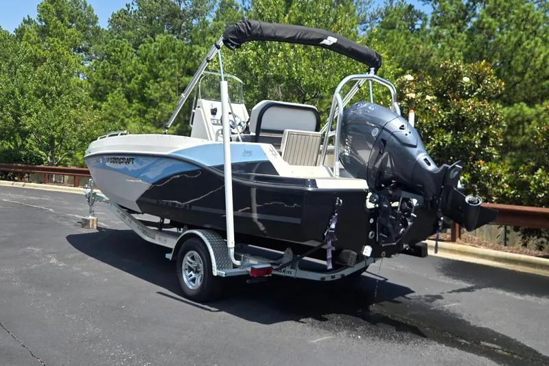 Slide: The Image of 2025 Starcraft SVX 191 OB CC boat on trailer, parked outdoors. - 4