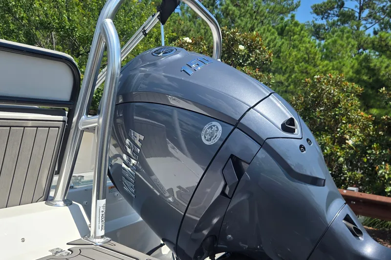 Slide: The Image of 2025 Starcraft SVX 191 OB CC boat with Yamaha outboard motor, surrounded by greenery. - 7
