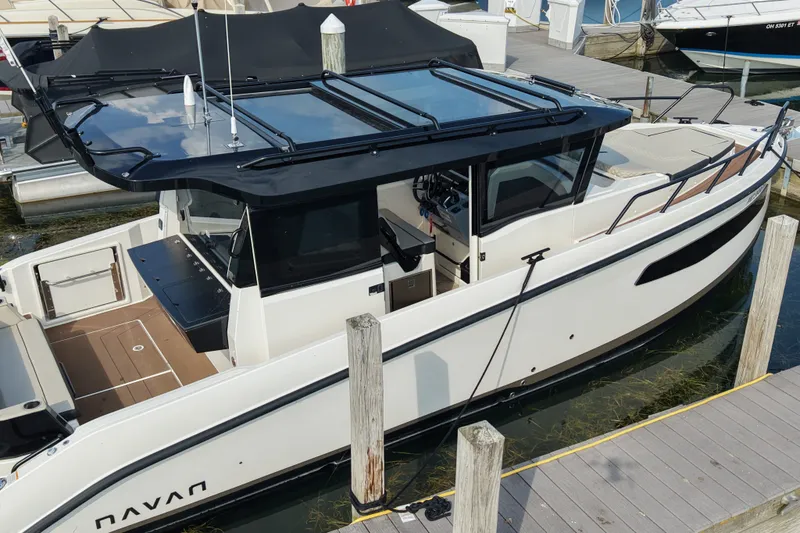 Slide: The Image of 2025 Navan C30 boat docked, featuring sleek design and modern amenities. - 23