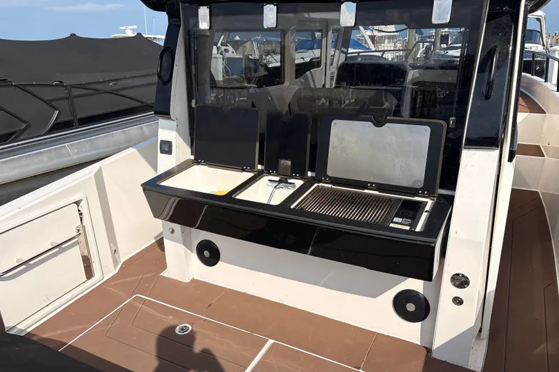 Slide: The Image of 2025 Navan C30 boat with outdoor kitchen and grill on deck. - 13