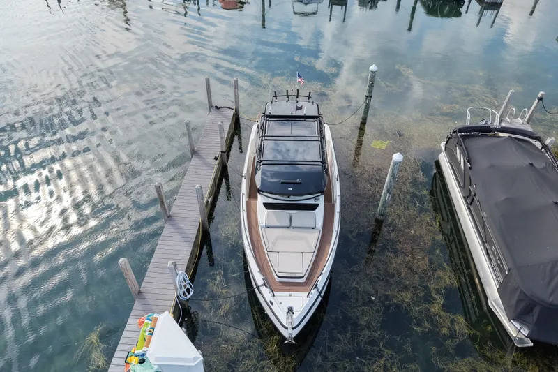 Slide: The Image of Aerial view of a 2025 Navan C30 boat docked at a marina. - 19