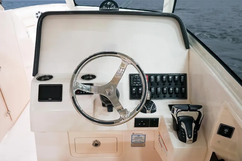 Slide: The Image of Manufacturer Provided Image: Helm console of Grady-White Freedom 325 boat, year 2026. - 5