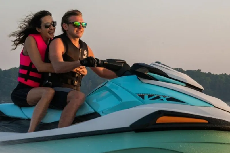 Slide: The Image of Couple enjoying a ride on a 2027 Yamaha WaveRunner VX jet ski. - 2