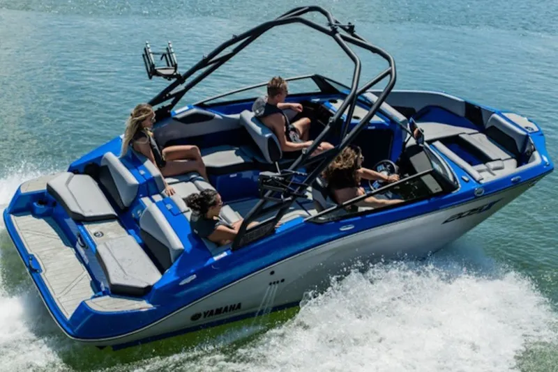 Slide: The Image of 2027 Yamaha Boats 205XD cruising on water with passengers enjoying the ride. - 5